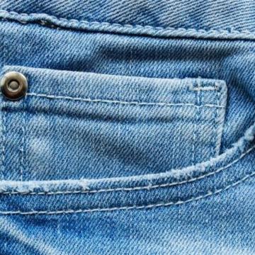 Why Jeans Have Small Metal Buttons on Their Pockets